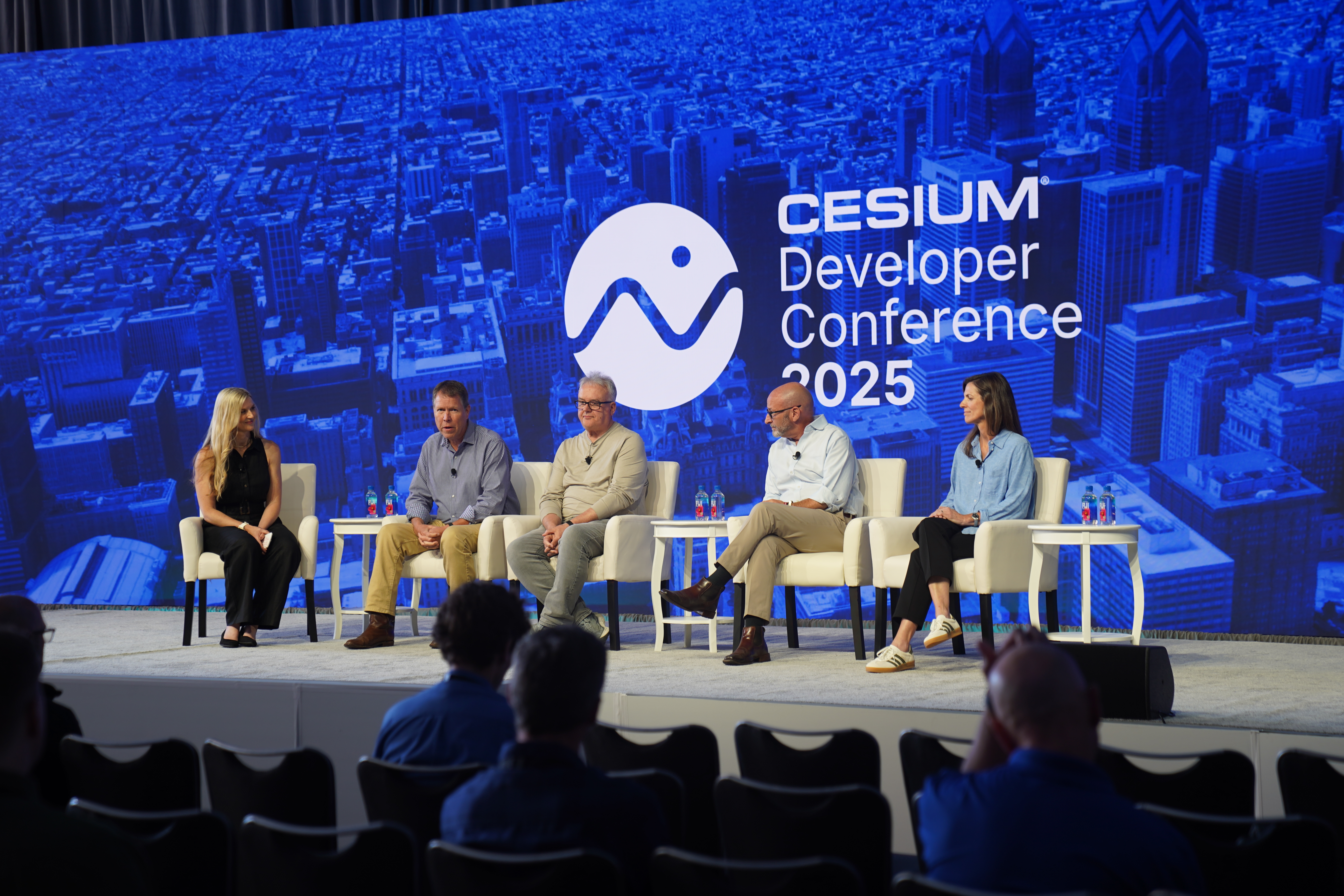 2025 Cesium Developer Conference panel: Pragmatic Approach to Open Standards with Emily Stearns, executive director, Metaverse Standards Forum; Scott Simmons, chief standards officer, OGC; Neil Trevett, VP, developer ecosystems, NVIDIA; David Rees, senior director for ground combat modeling and simulation, Maxar; and Amy Rose, CTO, Overture Maps Foundation.