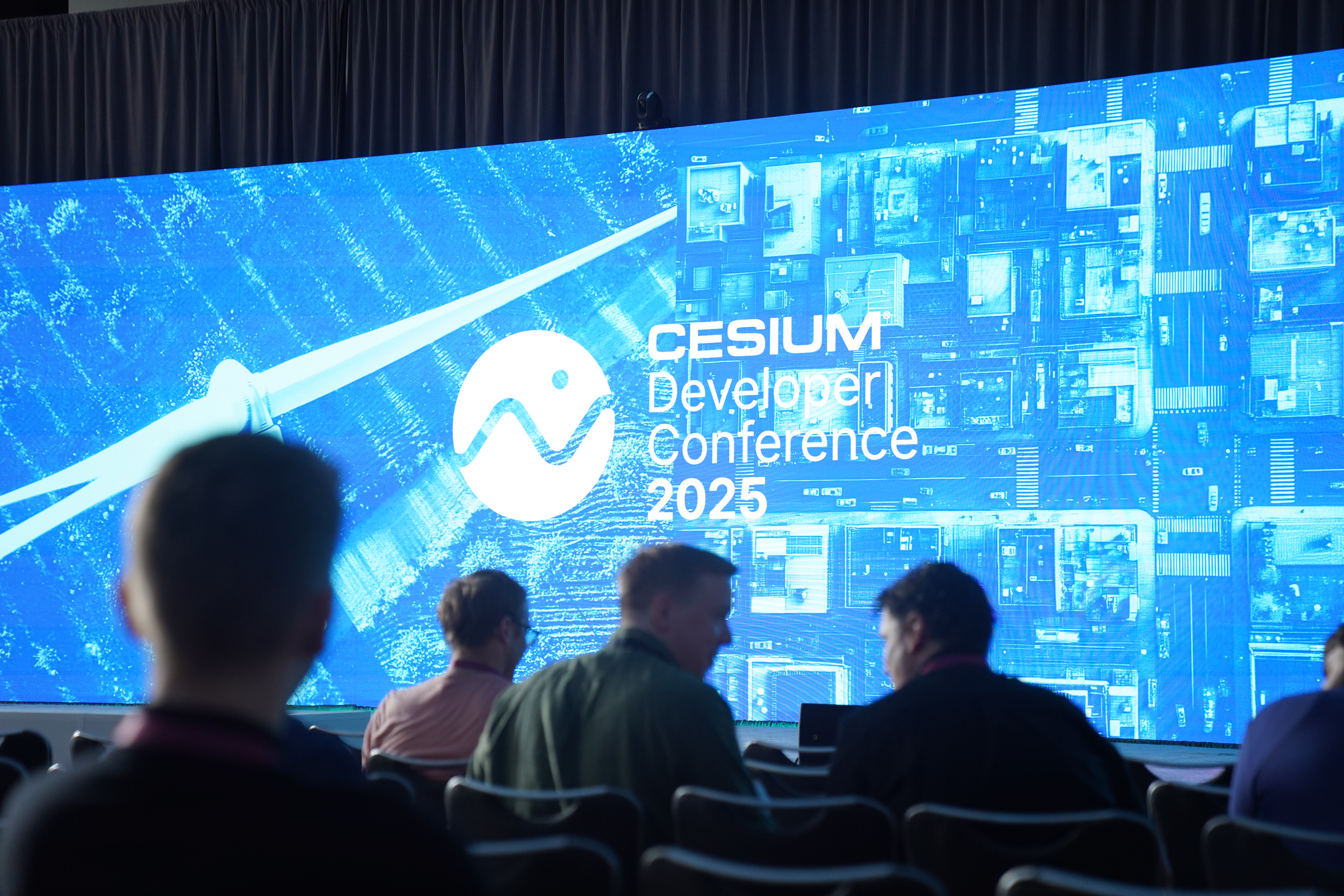 2025 Cesium Developer Conference opening screen with crowd.