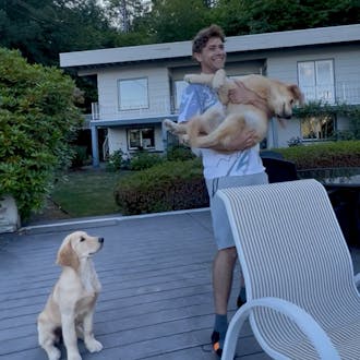Travis Crowell with two dogs