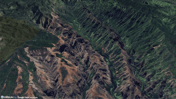 The mountains of the island of Kauai, Hawaii, visualized with the Google Maps 2D Satellite asset from Cesium ion