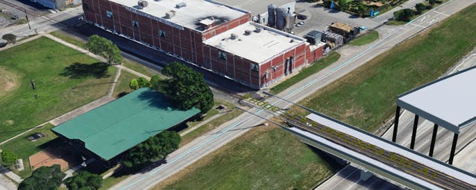 Cesium-powered geospatial capabilities in Connect reveal design conflict between a proposed railroad bridge and a historic building. Courtesy WSB.