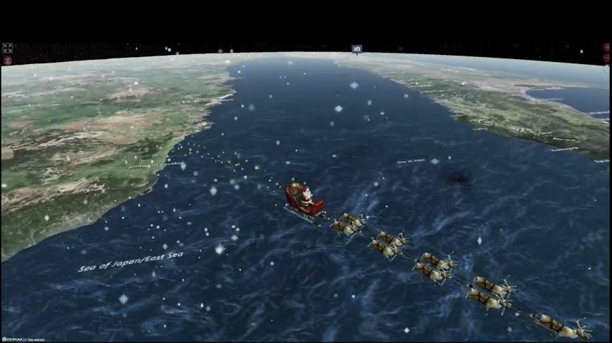 3D model of Santa, his red sleigh, and eight reindeer flying over green, brown, and blue terrain in CesiumJS in the NORAD Tracks Santa app. The scene includes snowflakes and a dark sky.