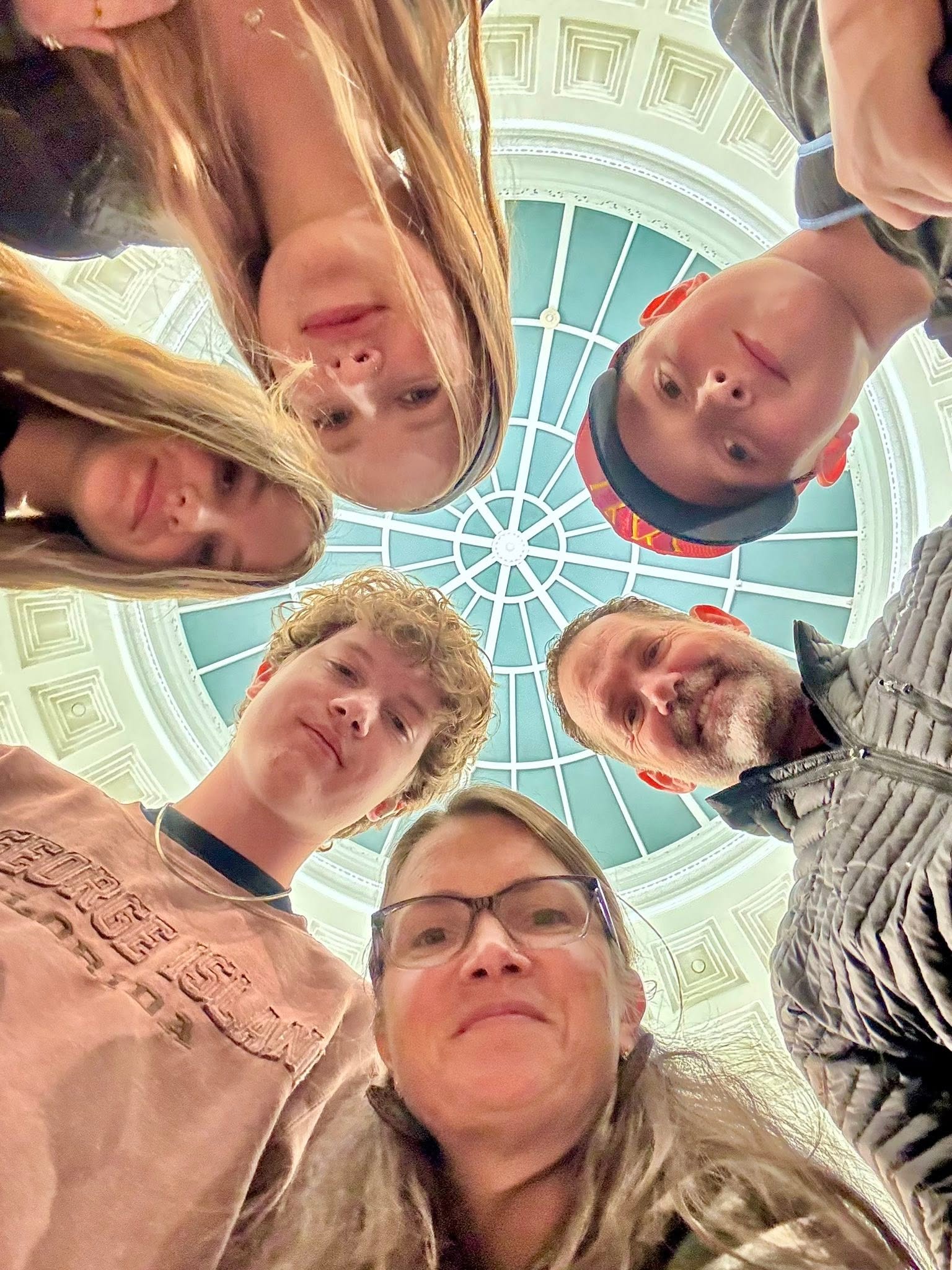Dan VanBrunt and his family looking down at the camera.