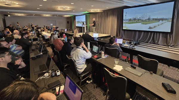 A group observes a talk at the 2025 Cesium Developer Conference