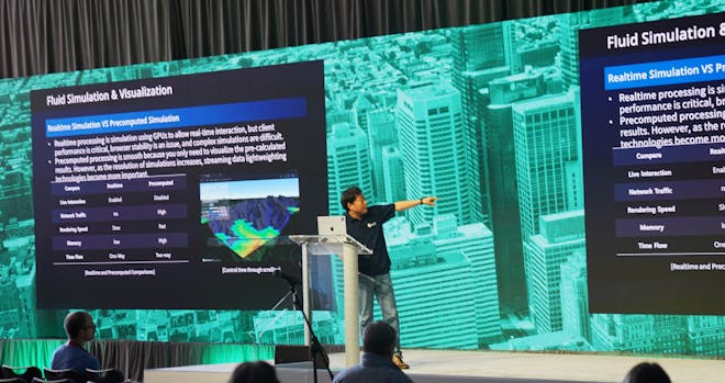 A presenter on stage at the 2025 Cesium Developer Conference in Philadelphia