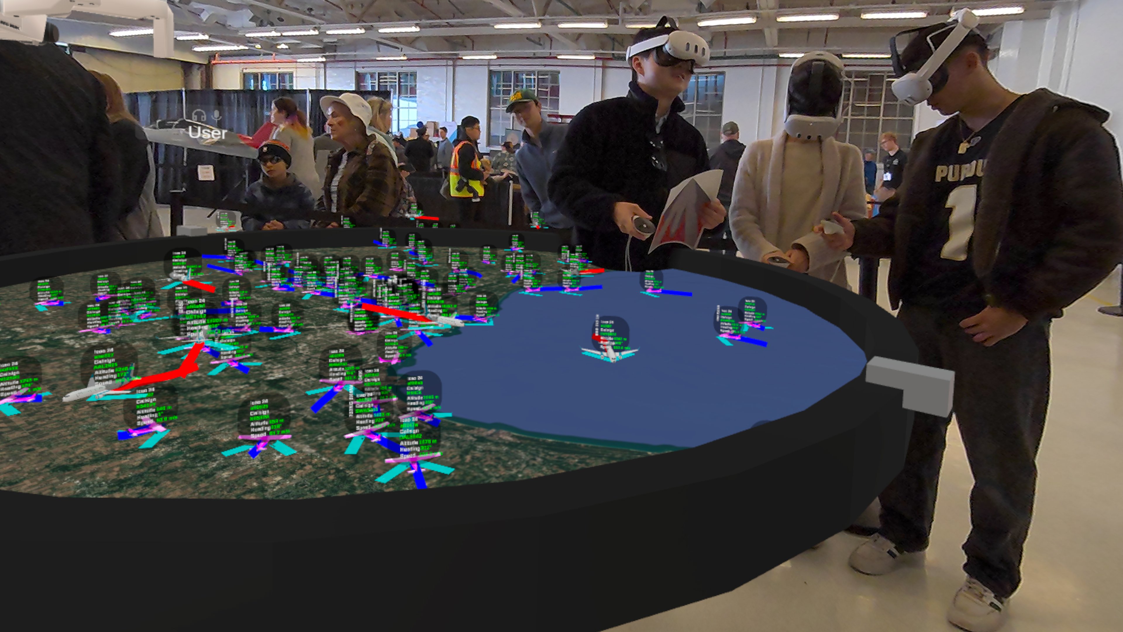 People viewing live flights visualized in VR with CollabXR by Purdue University Envision Center