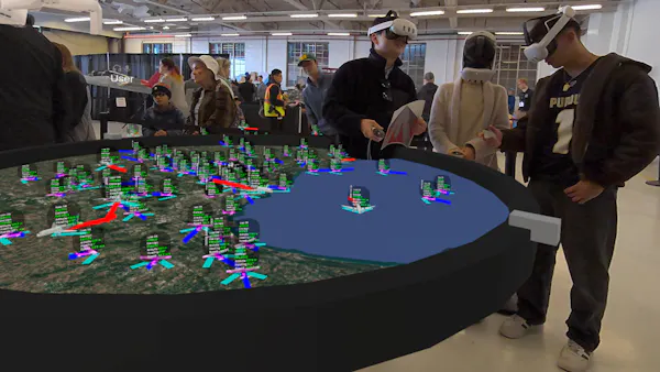 People viewing live flights visualized in VR with CollabXR by Purdue University Envision Center