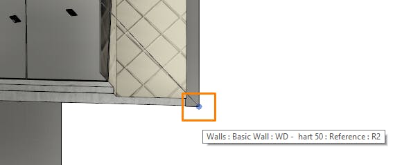 Cesium for Omniverse/Revit tutorial: Hover over the outer lower corner of the wall, and left click to place a survey point at this location.