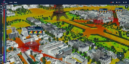 Blare Tech chose CesiumJS for its 5G tools to show large areas with accurate geospatial context and make the simulations available to anyone in the world. Pictured is Paris, France. The bottom of the Eiffel Tower is in the top-center of the photo, with red, yellow, and green signal indicators and white and black buildings. Courtesy Blare Tech.