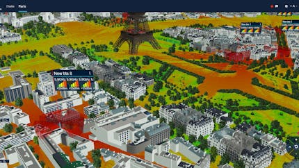 Blare Tech chose CesiumJS for its 5G tools to show large areas with accurate geospatial context and make the simulations available to anyone in the world. Pictured is Paris, France. The bottom of the Eiffel Tower is in the top-center of the photo, with red, yellow, and green signal indicators and white and black buildings. Courtesy Blare Tech.