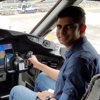 Shehzan Mohammed in the cockpit of an aircraft.