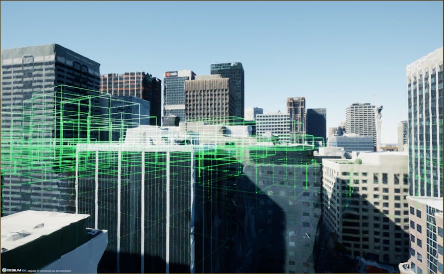Fig 2.1: Renderer-level occlusion culling employed by Unreal Engine on the streamed meshes created by Cesium for Unreal. Each green bounding box represents an occlusion culled mesh in the background that is hidden behind the visible buildings in the foreground.