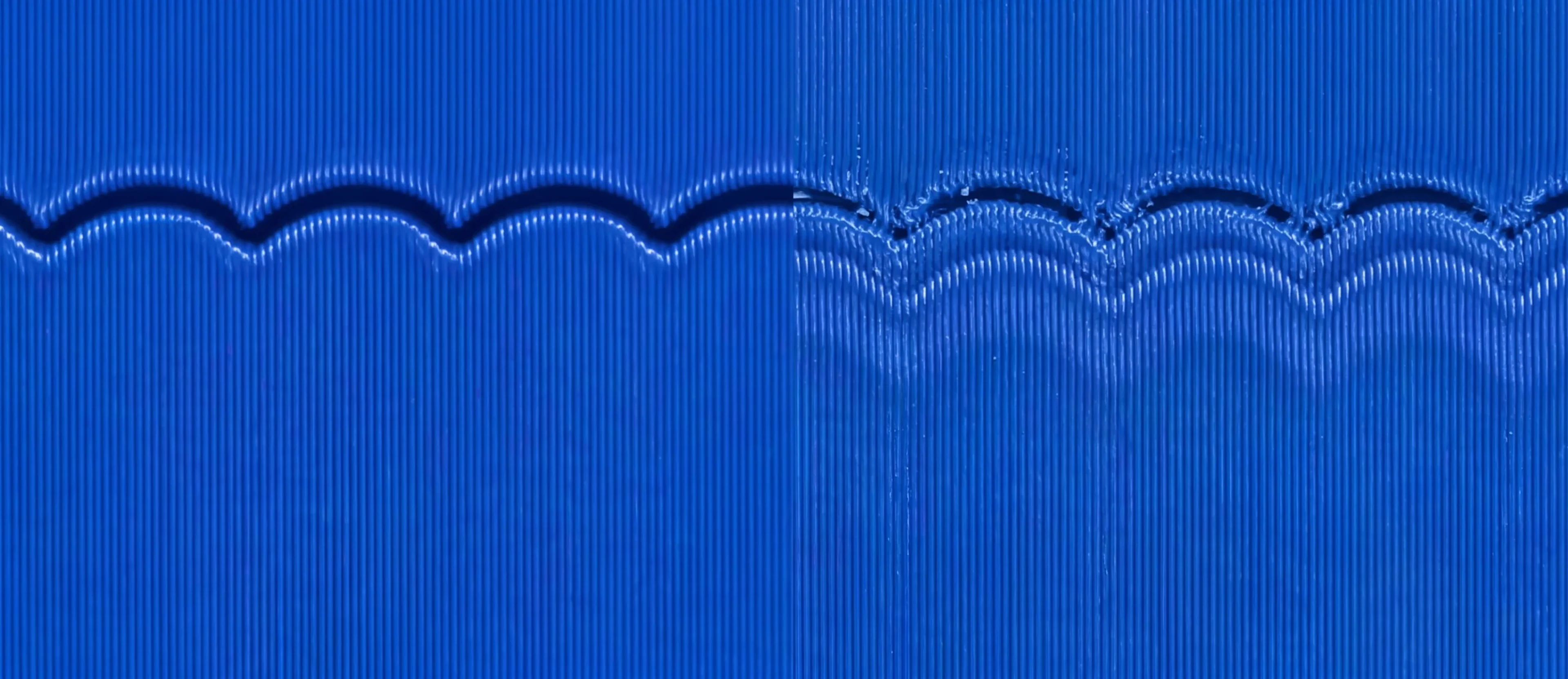 The same print wall side by side — with vibration compensation on (left) the edge is crisp; with it off (right) ghosted echoes ripple out below it