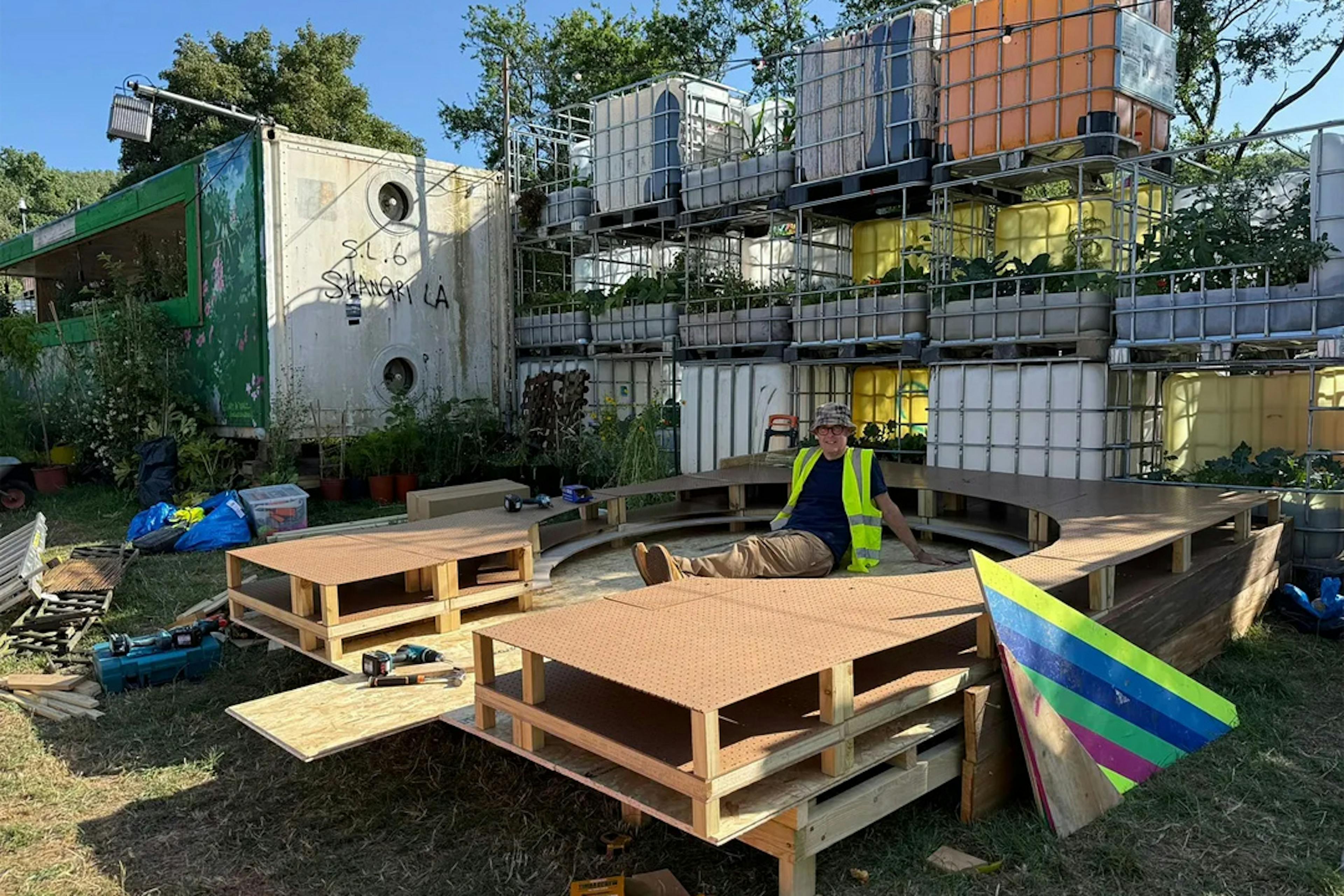 Dave Webb installing the base of the Fieldworks installation at Shangri-La, Glastonbury Festival 2025