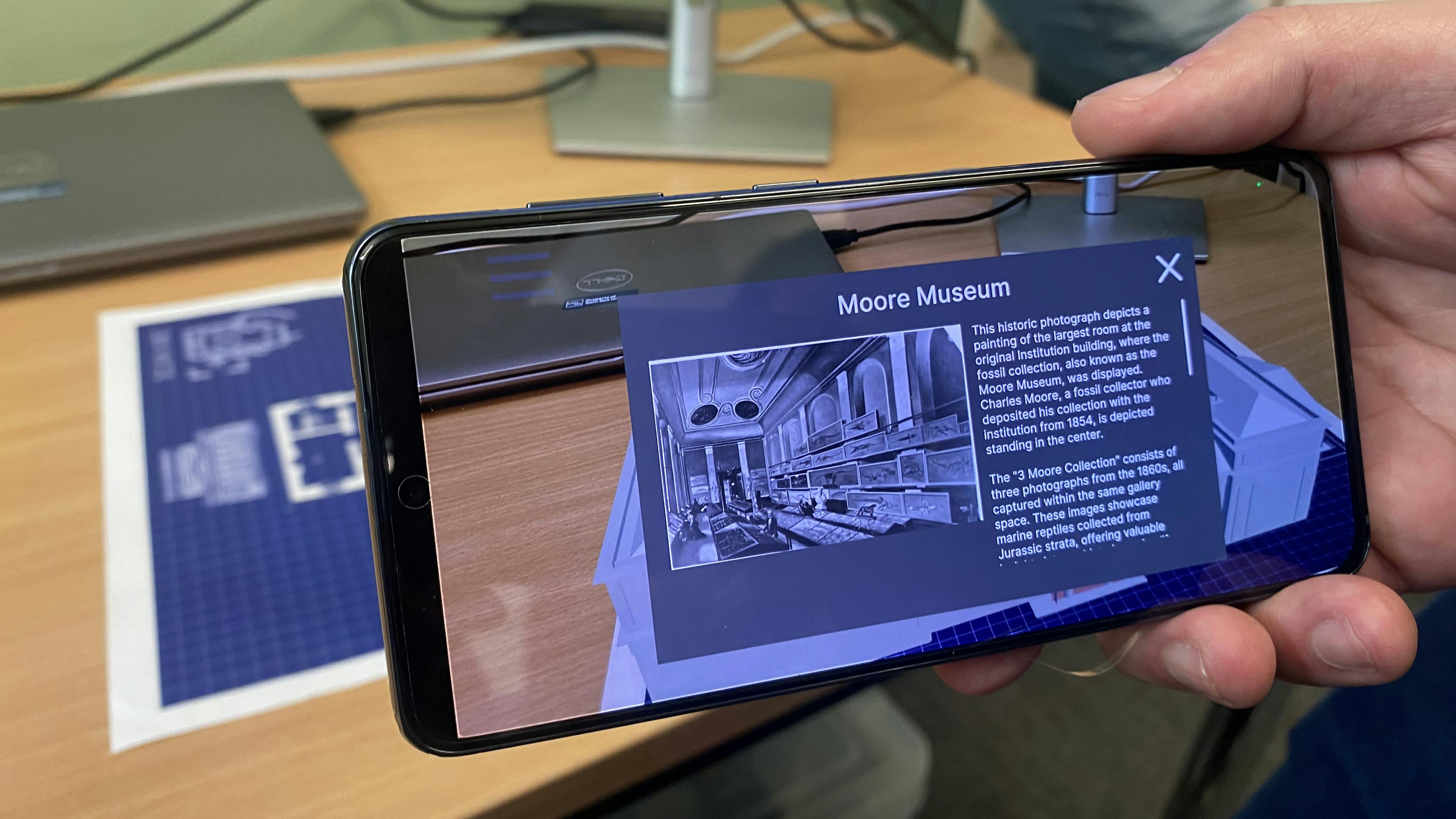 Image from augmented reality map showing archival exhibition images and 3D model of the original museum