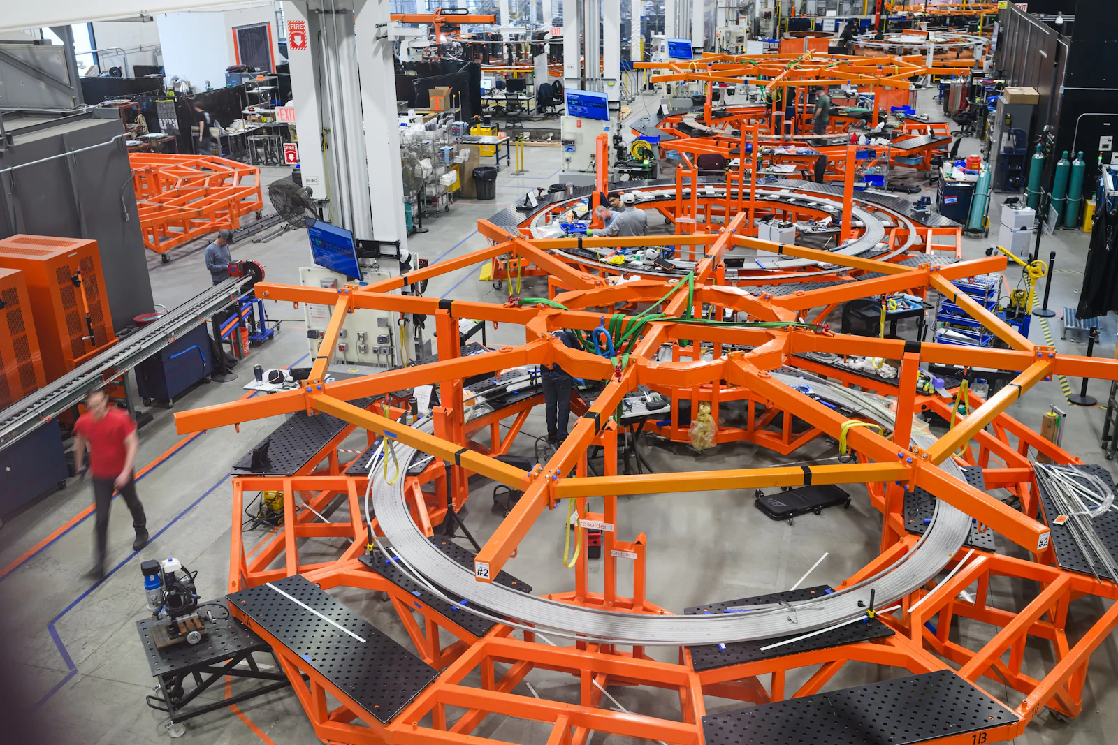 A photo inside the CFS magnet factory showing the production of poloidal field magnets
