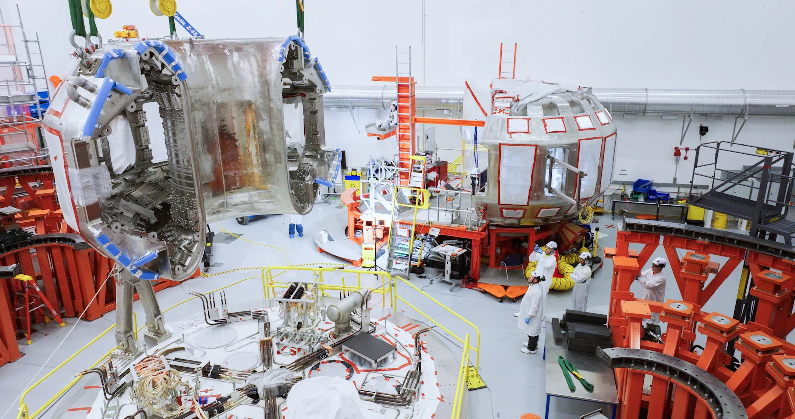 The second half of SPARC's vacuum vessel getting moved into place inside CFS tokamak hall, adjacent to its other half