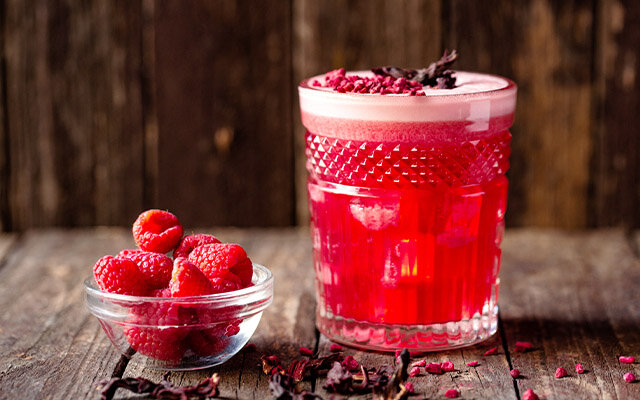 With a touch of Bitters and lots of gin, this Bakewell Sour is a raspberry and almond delight.