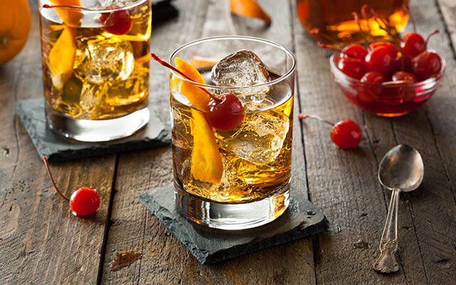 Cocktail Garnished With Fruit And Berries