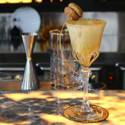 Ritorno A-morbello cocktail with biscotti garnish