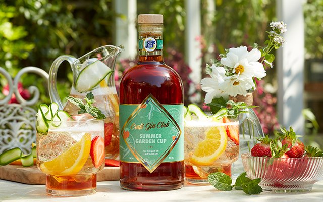 Summer Garden Cup cocktail with fresh fruit garnish