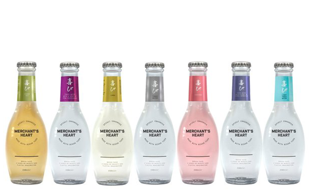Seb Heeley and Jen Wiggins of Manchester Gin against bumble bee graffiti