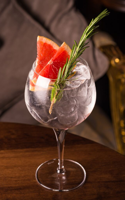 Gin and Tonic Perfect pink grapefruit and rosemary garnish