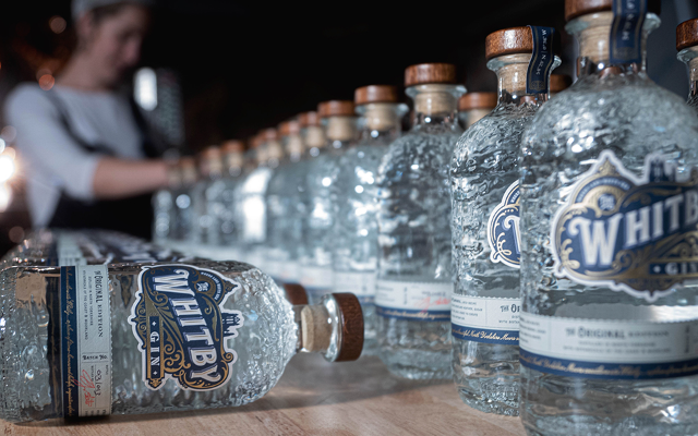 A line up of Whitby Gin bottles
