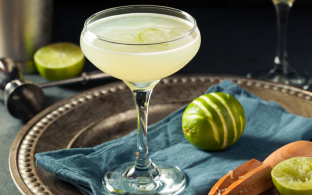 Low calorie Gin Gimlet cocktail with lime in a coupe glass
