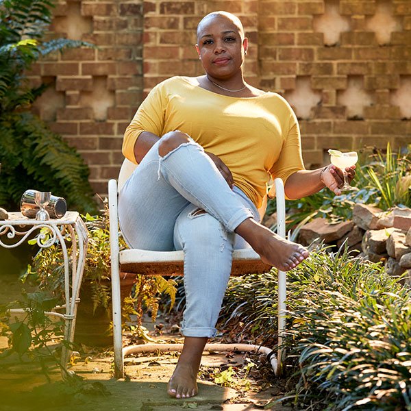 Tiffanie Barriere sat on chair