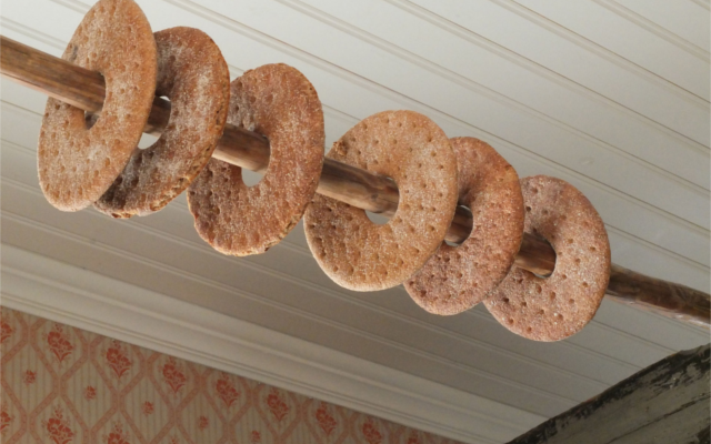 Rye Bread Drying on a Pole in a house.png