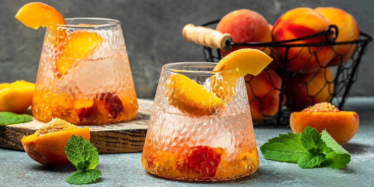 This fabulous Peach Gin Spritz mixes gin with peach schnapps and