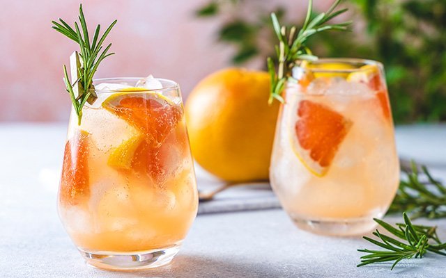Grapefruit Spritz with rosemary garnish