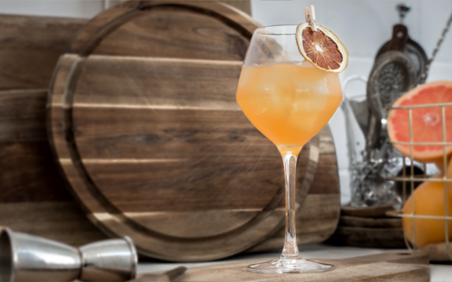 Kongsgaard Gin Root to Fruit cocktail with orange garnish