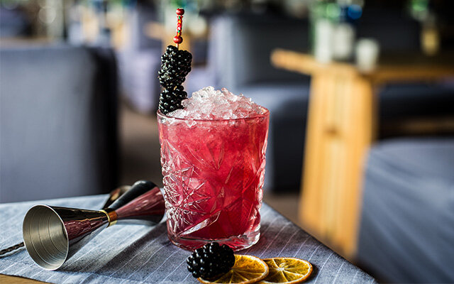 Cocktail with blackberries