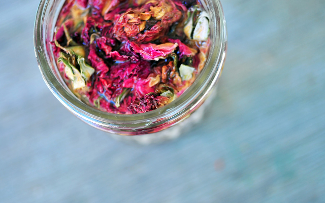 Rose petal and bud infused gin in a jar