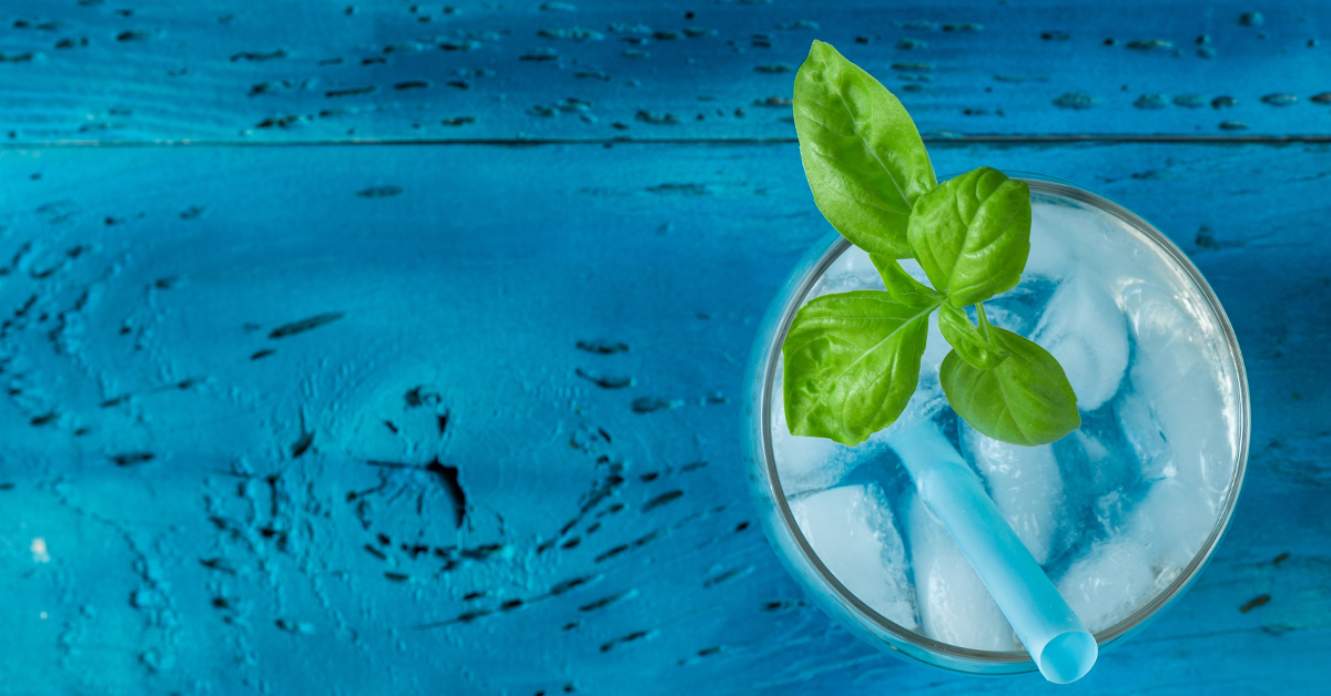 Blue wood gin cocktail garnish basil
