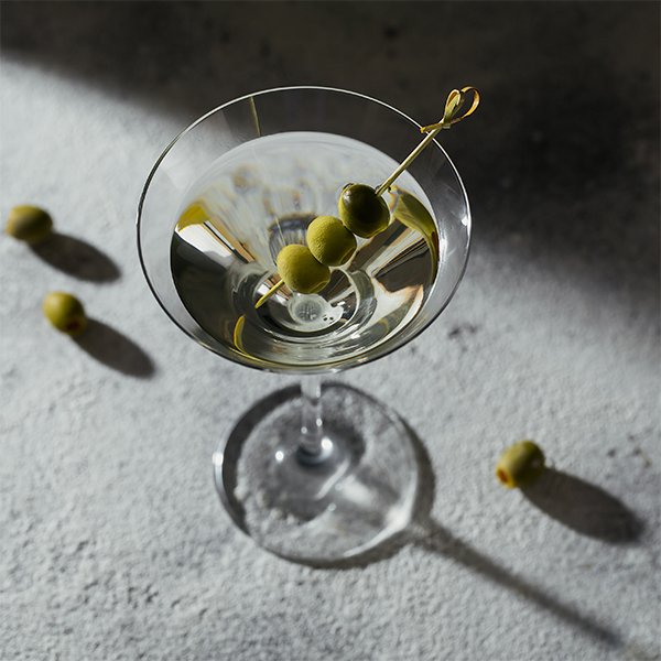 Martini cocktail with olive garnish