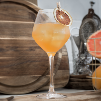 Kongsgaard Gin Root to Fruit Cocktail garnished with orange slice