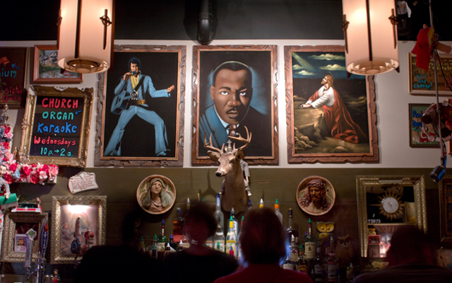 Sister Louisa's Church of the Living Room and Ping Pong Emporium in Atlanta with art covered walls crazy gin joint