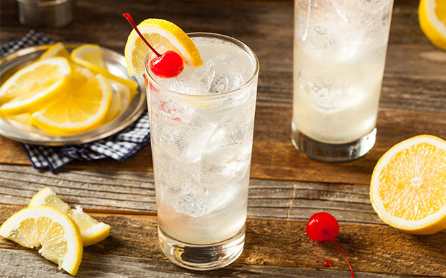 Cocktail with lemon and cherry