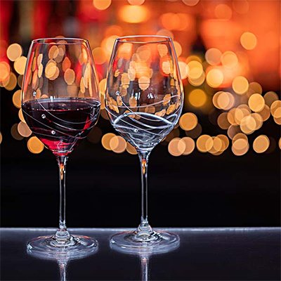 Two Dartington Crystal glasses from their glitz glassware range featuring crystals