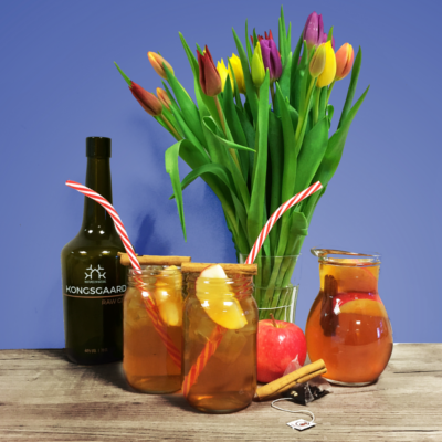 Danish Double Apple Iced Tea with Kongsgaard Gin with Tulips in a Vase and jug of the cocktail