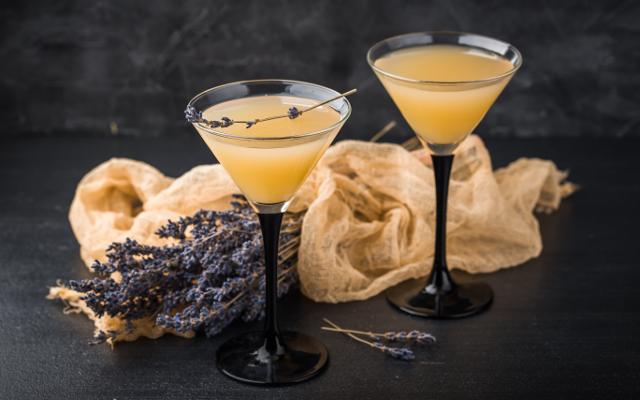 Lavender bees knees gin cocktail with lavender on a dark background.png