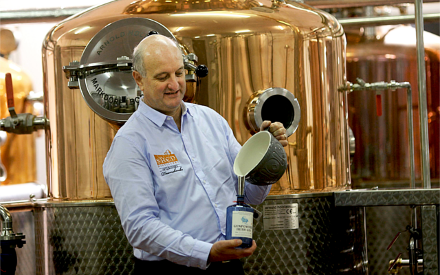 Spirit of curiosity gin distillery pouring gin into bottle
