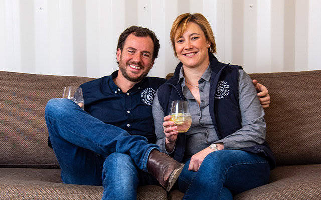 Jon and Nicole enjoying a G&T on the sofa