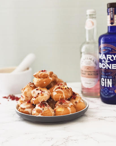 Marylebone gin and fentimans pink grapefruit tonic water topped profiteroles covered in pink peppercorns from the gin baker