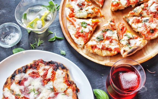 Margherita Pizza and Basil toppings and gin cocktails with garnishes
