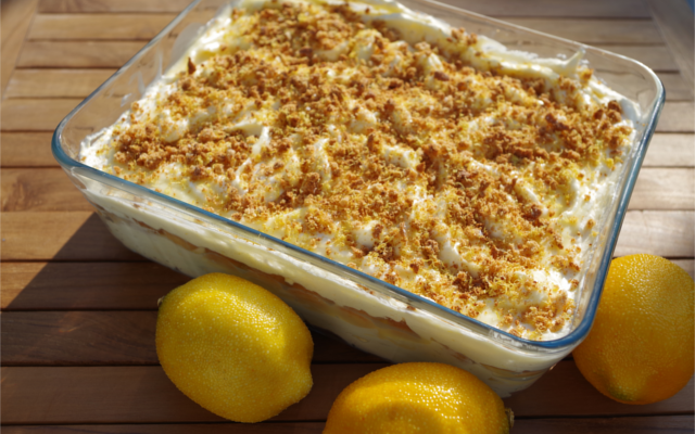 Gin-a-misu tiramisu boozy dessert with lemons on a wooden table