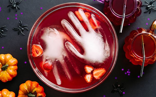 Ice hand Halloween cocktail garnish idea